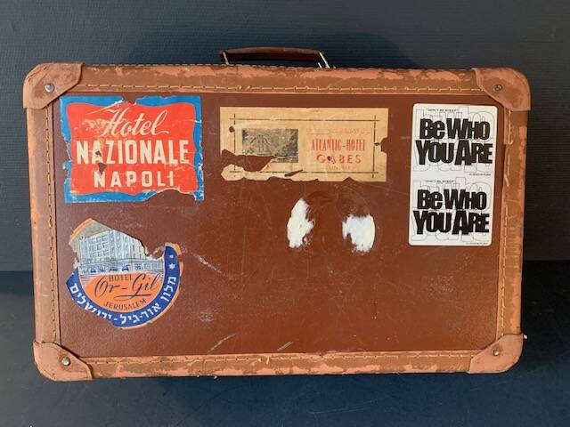 Old travel suitcase and legendary stickers, 1920
