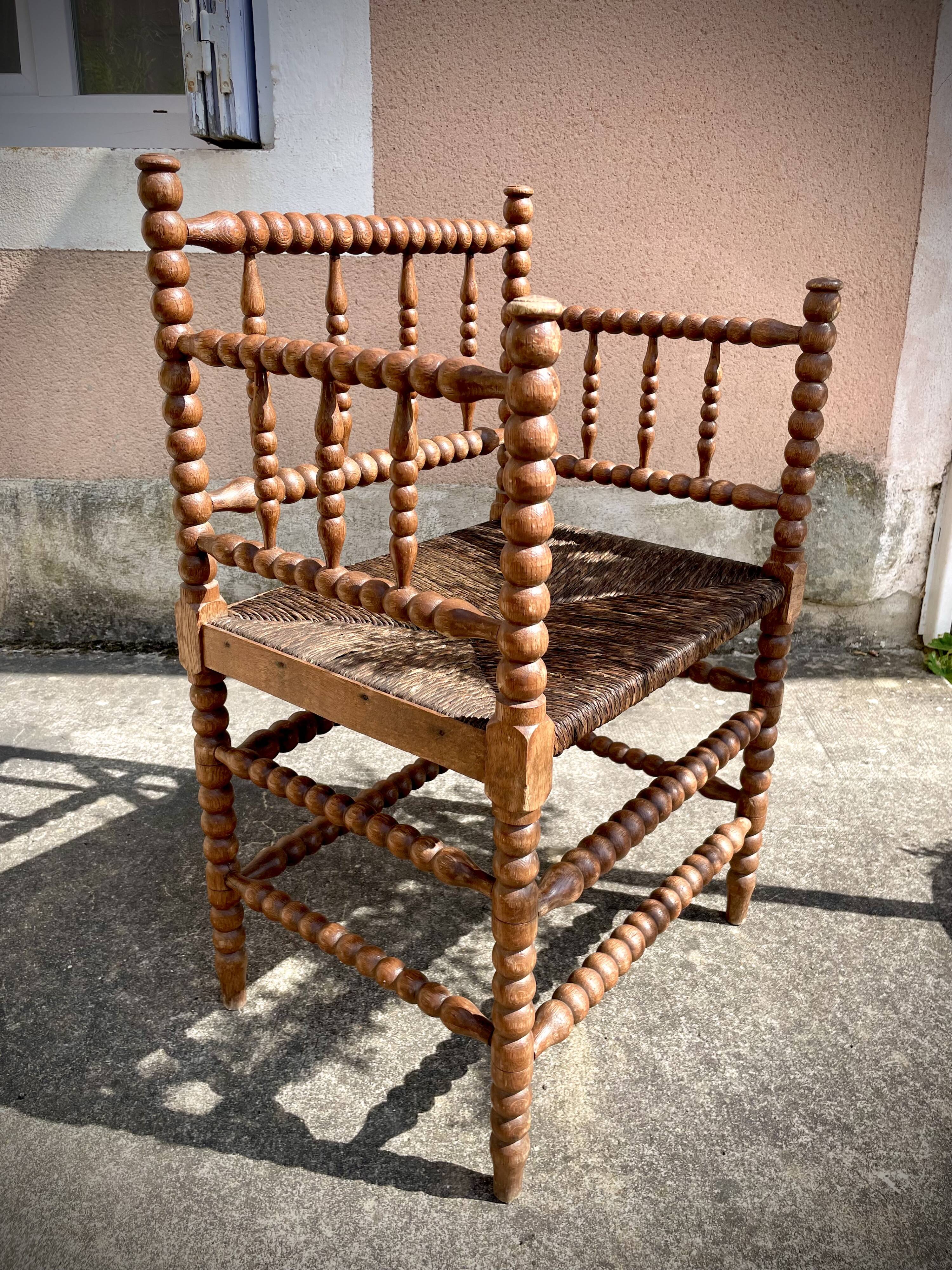 Antique Bobbin armchair with straw seat