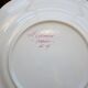 Three small hand-painted Saint-Clément dinner plates.