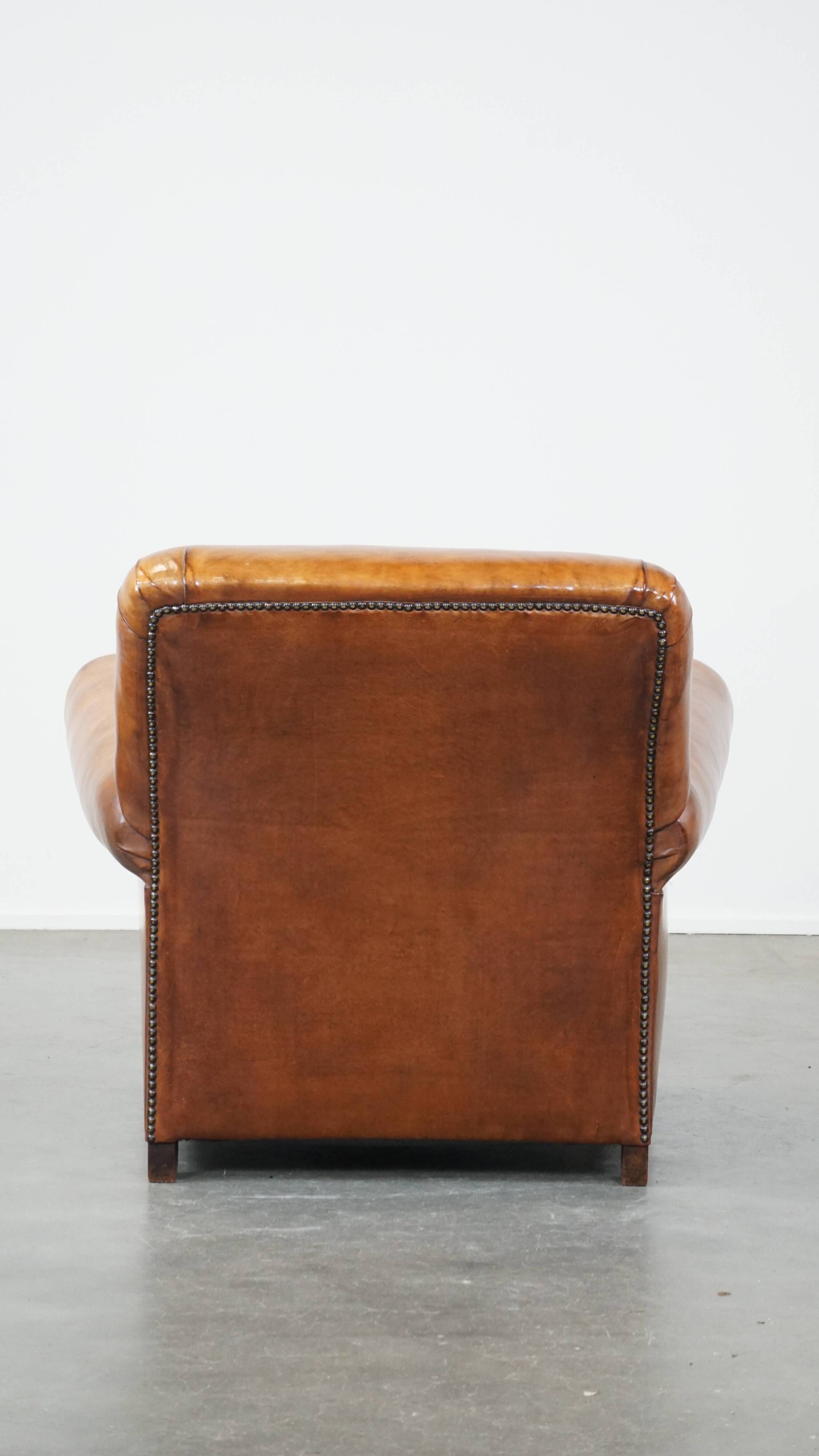 Cognac-colored antique sheep leather armchair