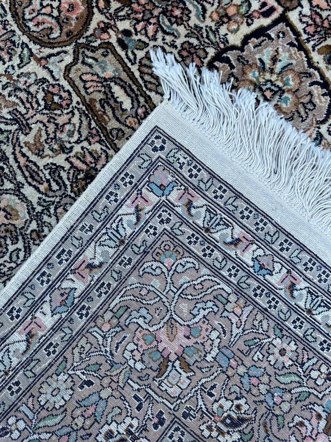 Hand-knotted Persian silk rug