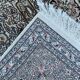 Hand-knotted Persian silk rug