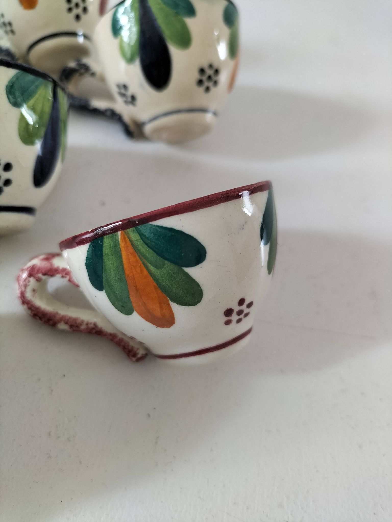 Set of 7 miniature Quimper earthenware cups