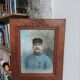 Antique wooden frame with carved portrait knot
