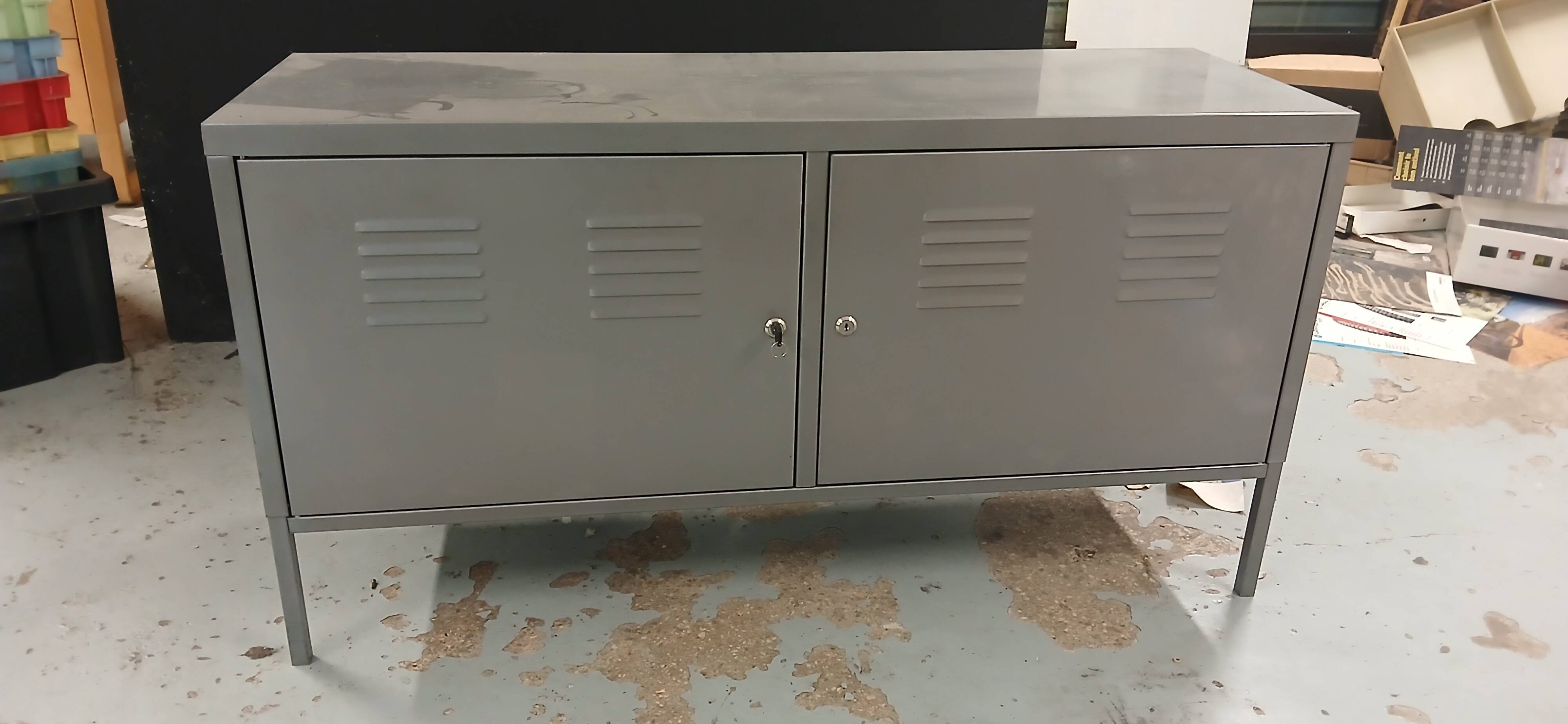 Small mouse gray industrial piece of furniture/sideboard.