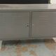Small mouse gray industrial piece of furniture/sideboard.