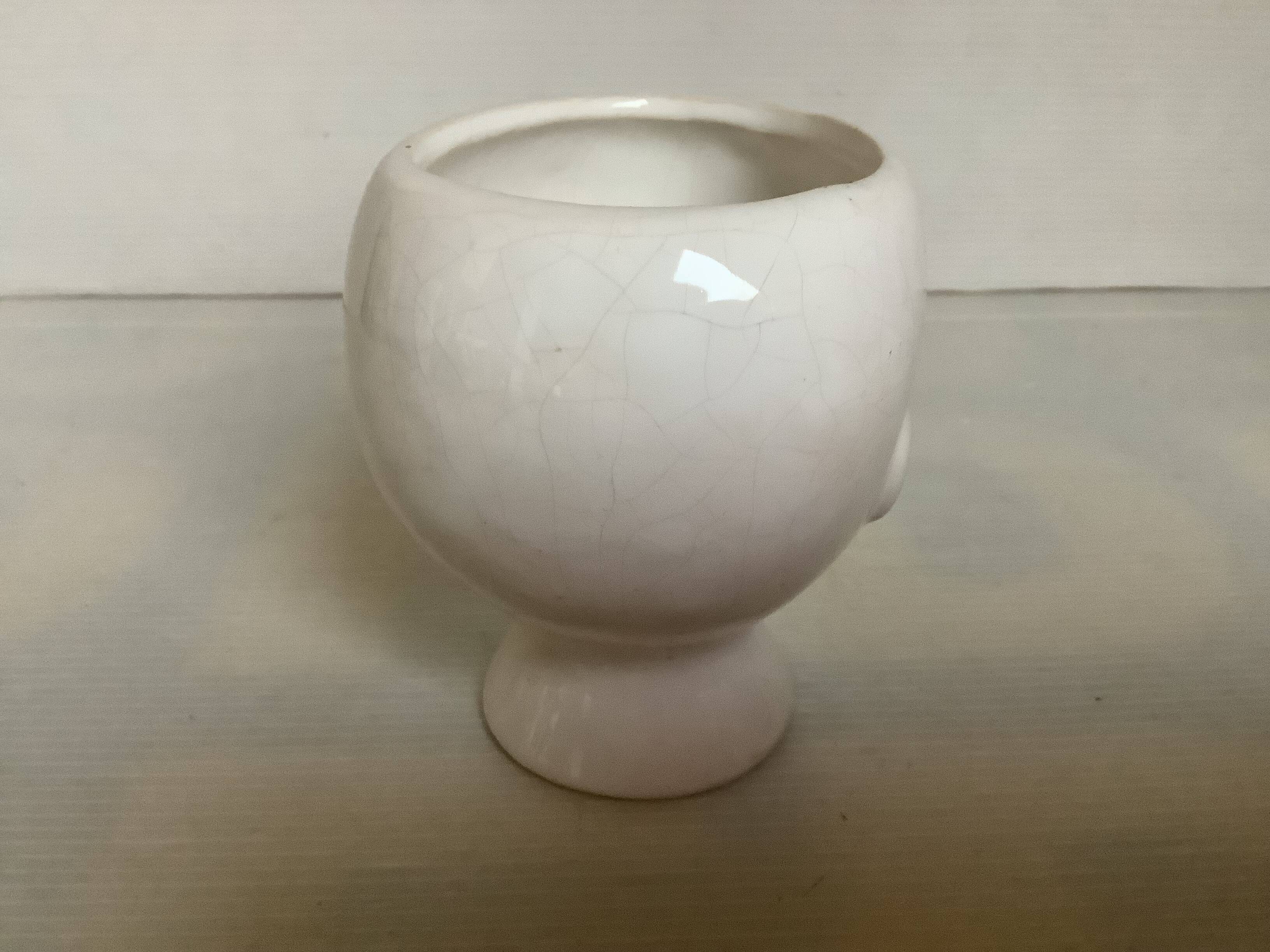 Baby doll shaped vase planter