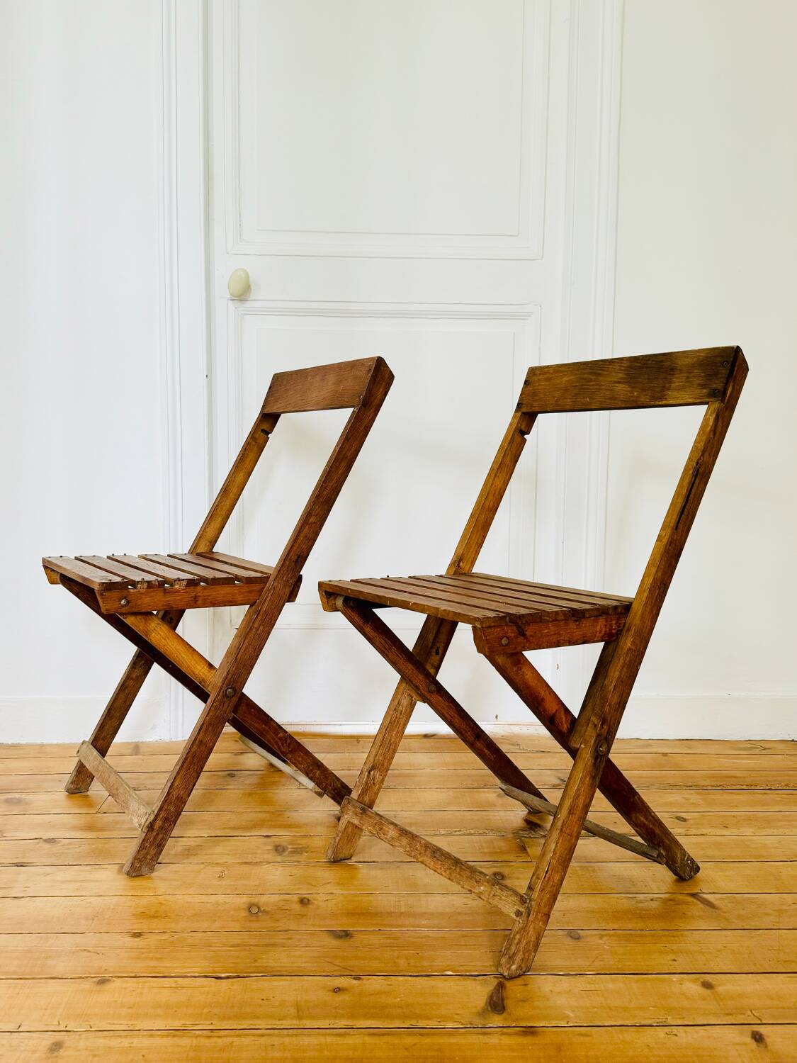 Two vintage wooden folding chairs, circa 1960