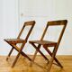Two vintage wooden folding chairs, circa 1960