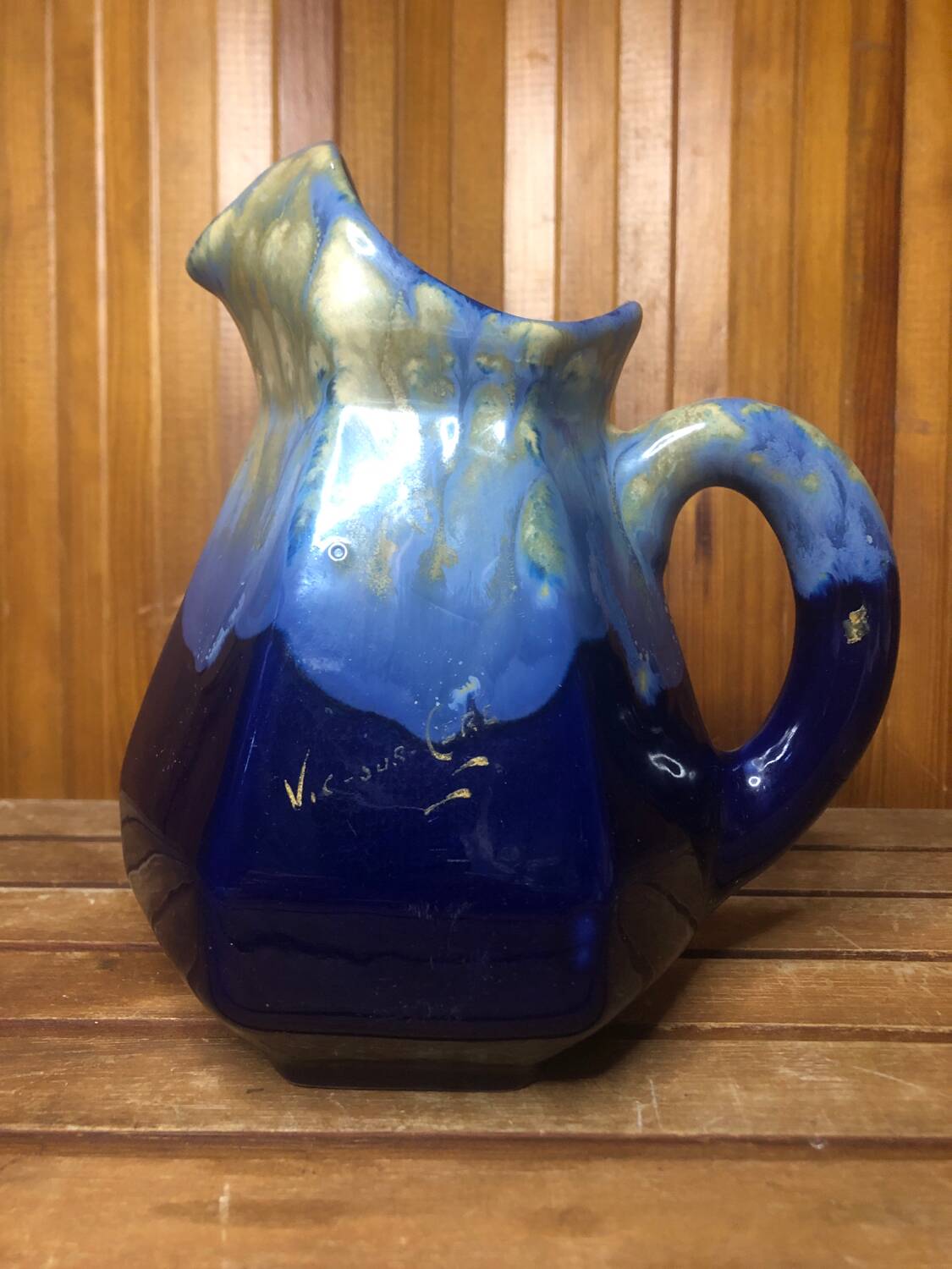 Old vintage blue ceramic pitcher