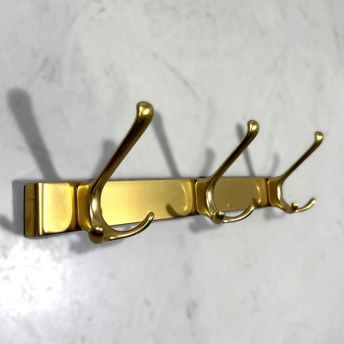 Gold coloured aluminium wall coat racks 1960’s