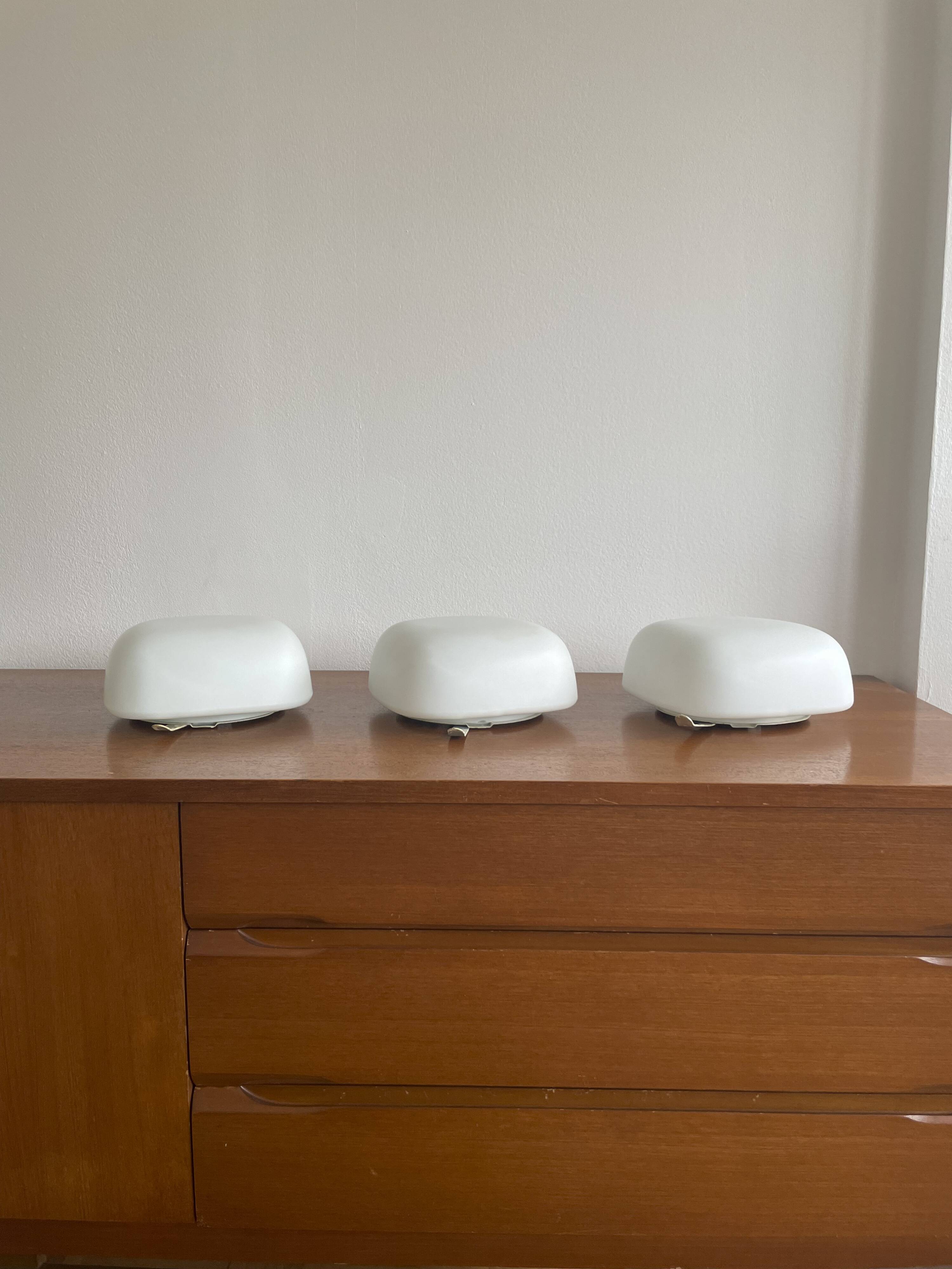 Square wall lights in sandblasted white glass