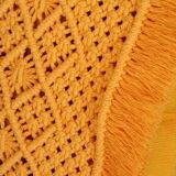 cushion and its macramé adornment