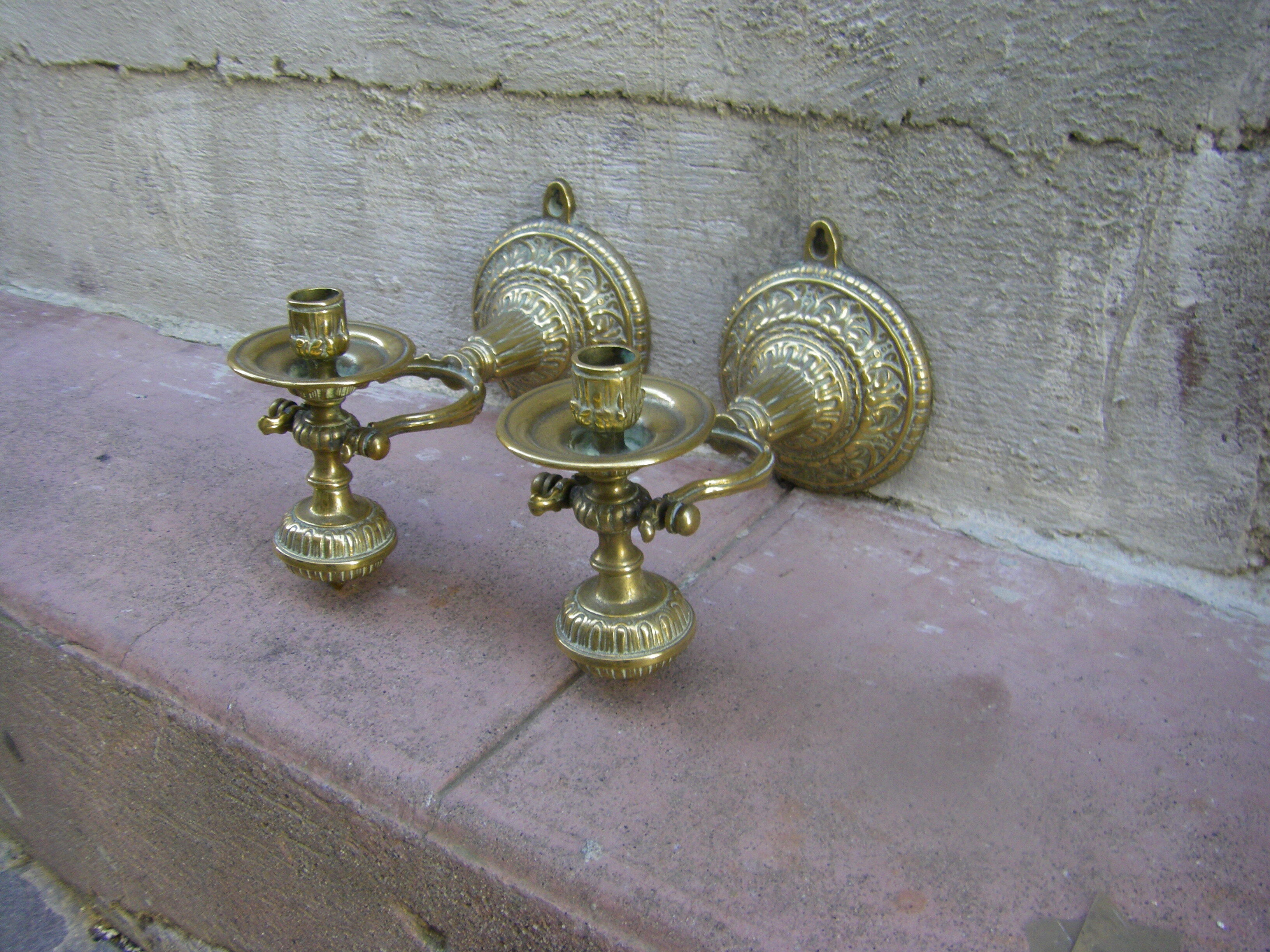 Pair of pendulum candle holders