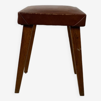 Small stool or footrest in wood and leather