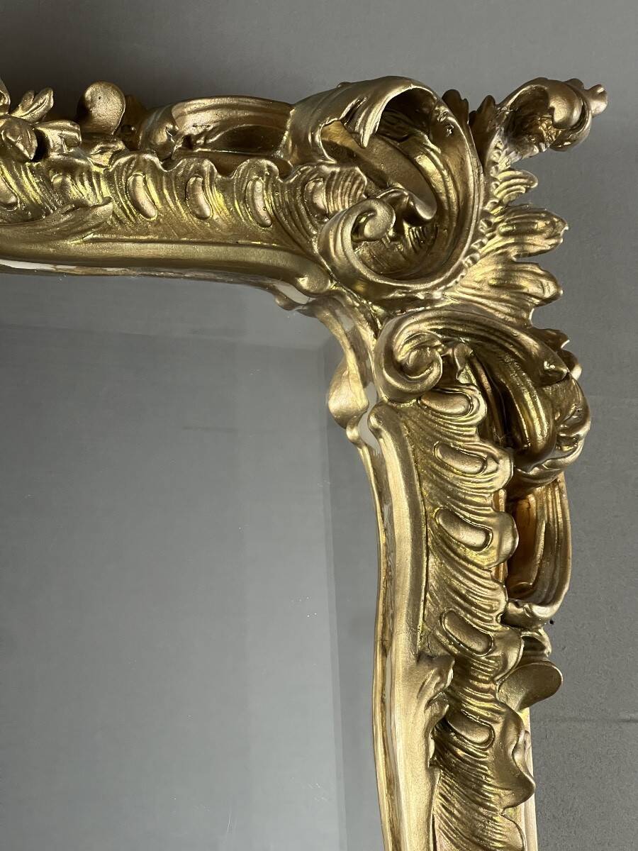 Large gilded wooden mirror in Louis XV style, 19th century.