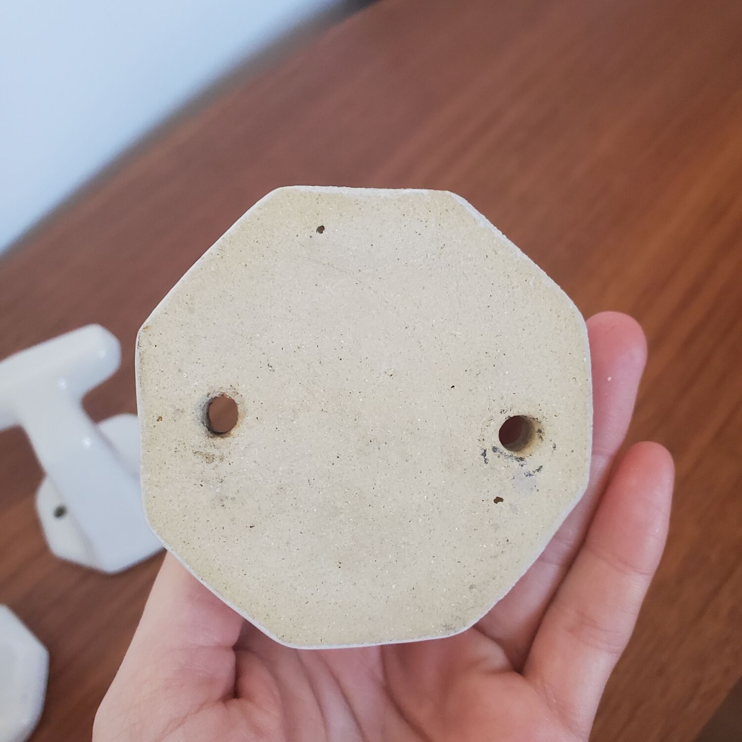 Trio of white porcelain hooks