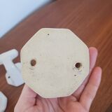 Trio of white porcelain hooks