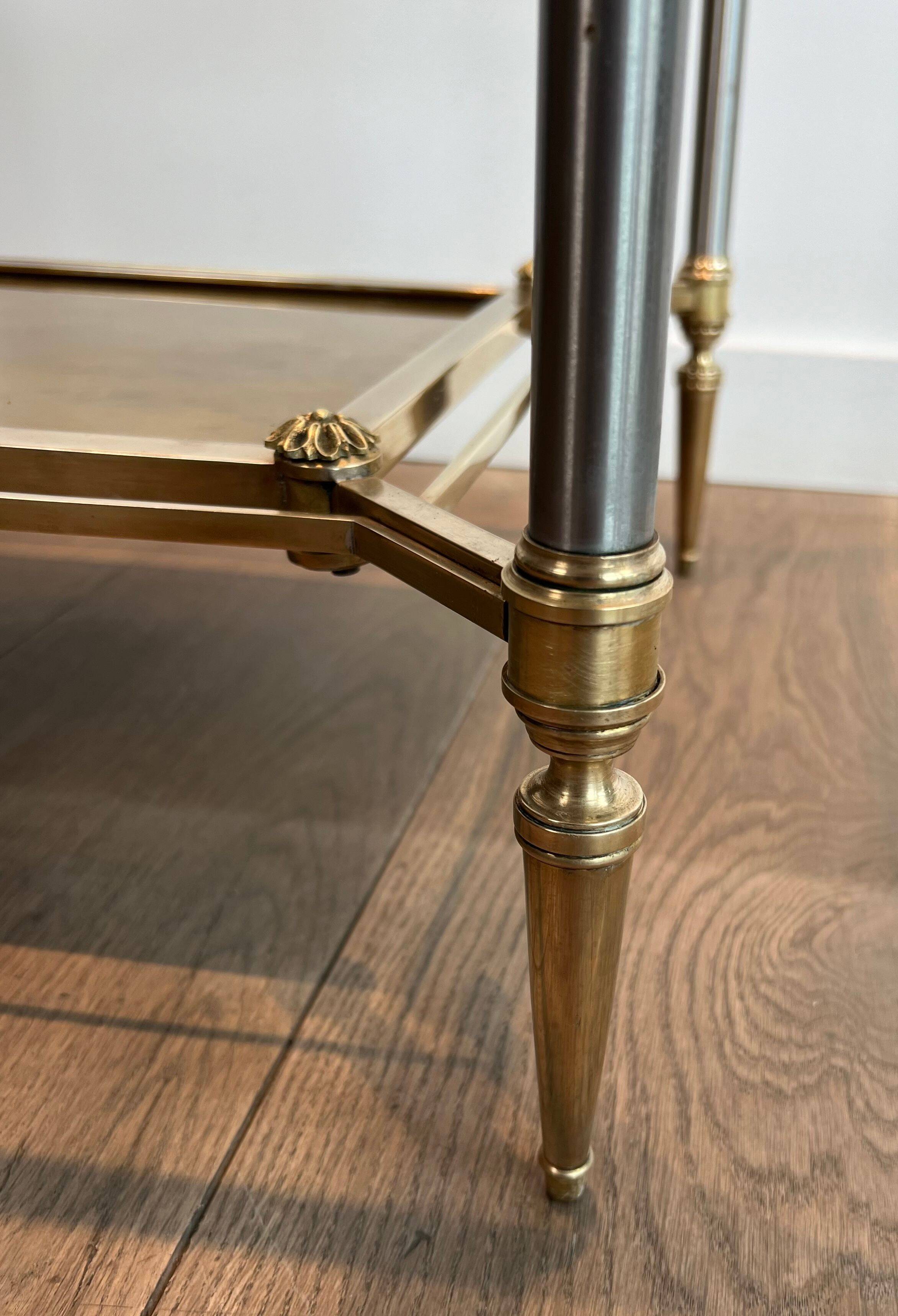 Pair of neoclassical side tables in steel and brass by Maison Jansen.