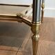 Pair of neoclassical side tables in steel and brass by Maison Jansen.
