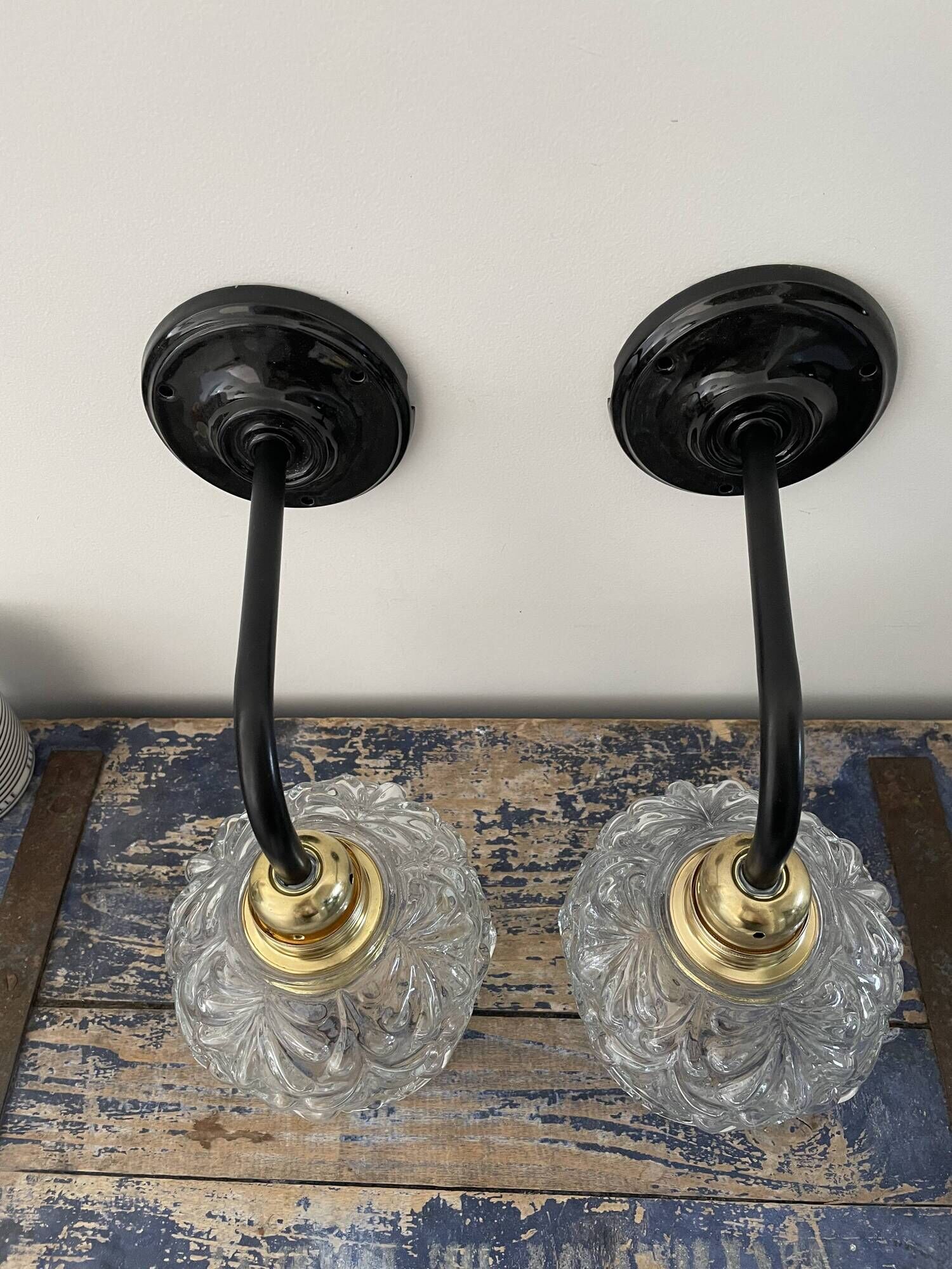 Pair of vintage electrified to nine-piece chiseled glass wall lamps
