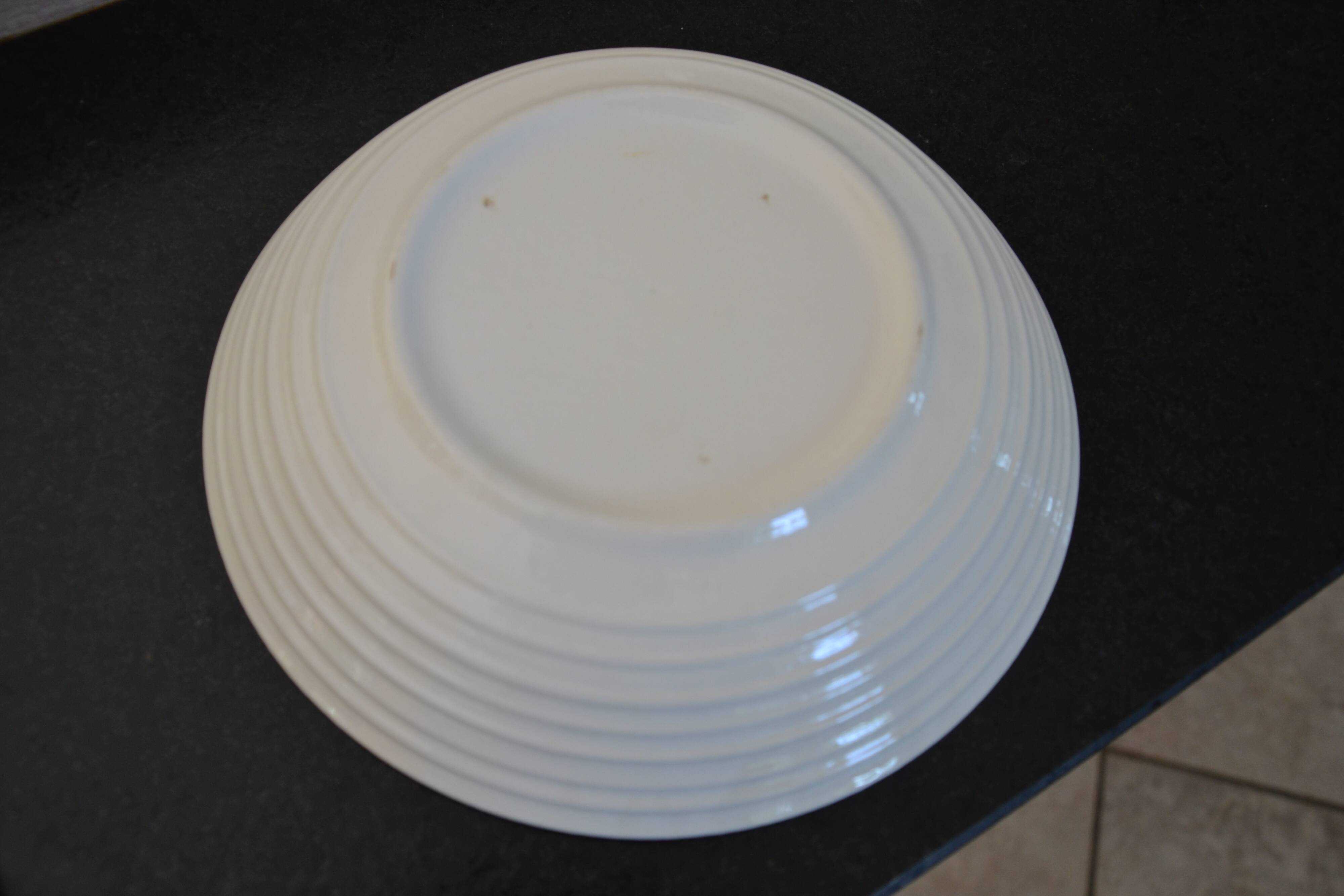 Set of 7 soup plates, dishes and a tureen with flower decoration