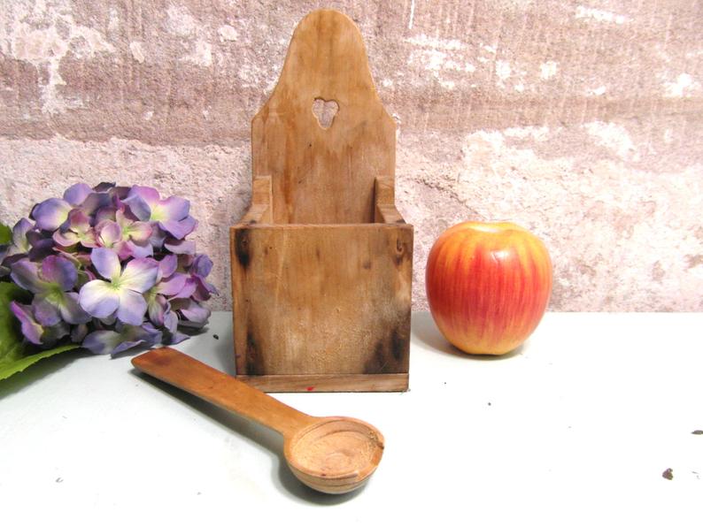 Vintage wooden salt box with spoon