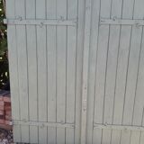Pair of wooden shutters hanging iron