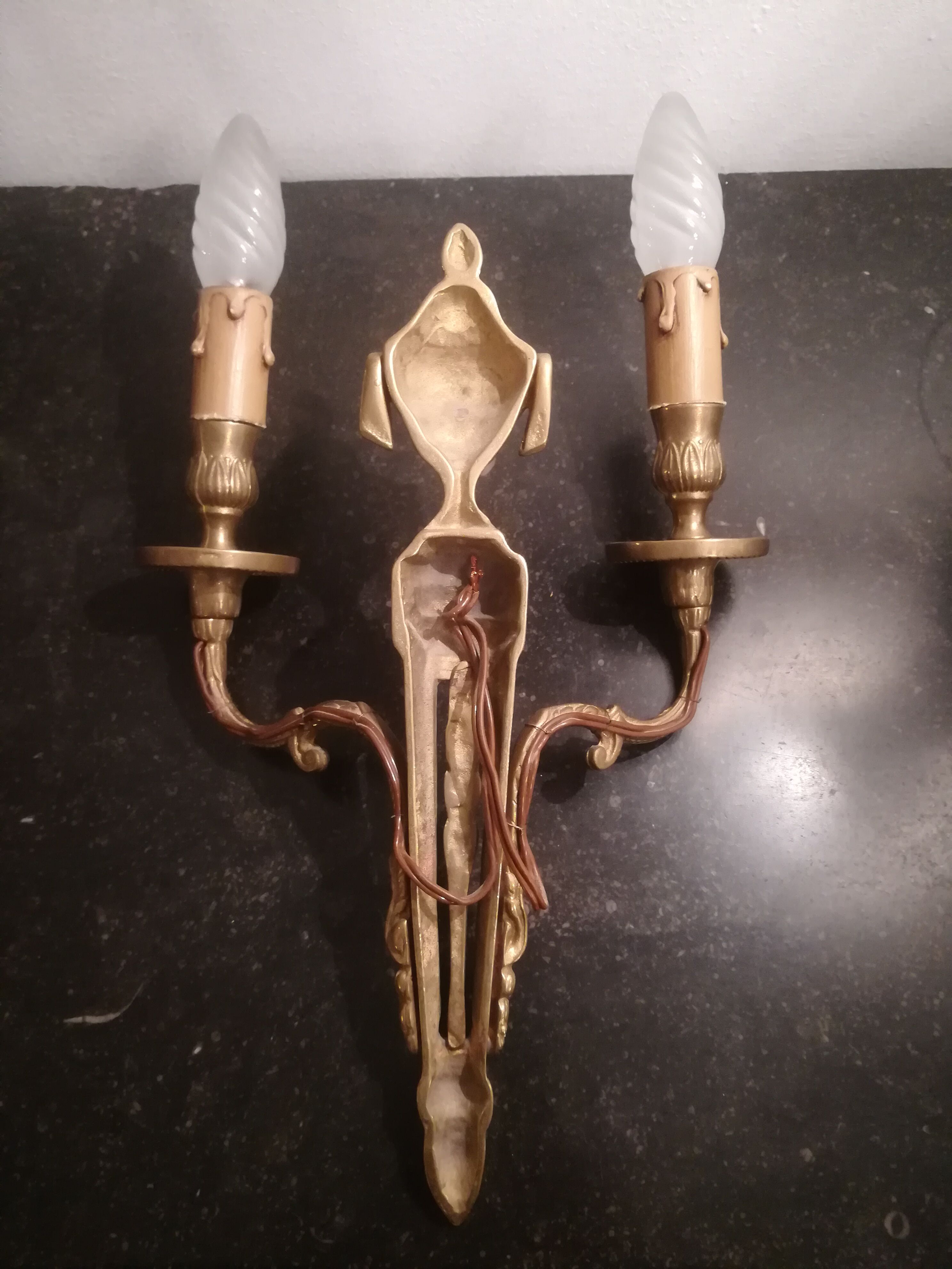 Pair of Louis XVI style sconces in gilded bronze