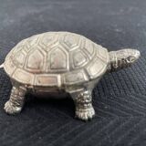 Ancient tortoise in silver metal