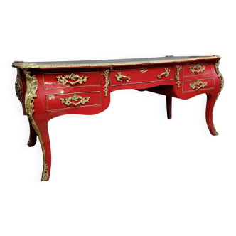 Louis XV style curved center desk in red lacquer and gilded bronze