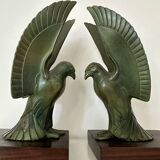 Pair of eagle bookends in green patina regula with rosewood base