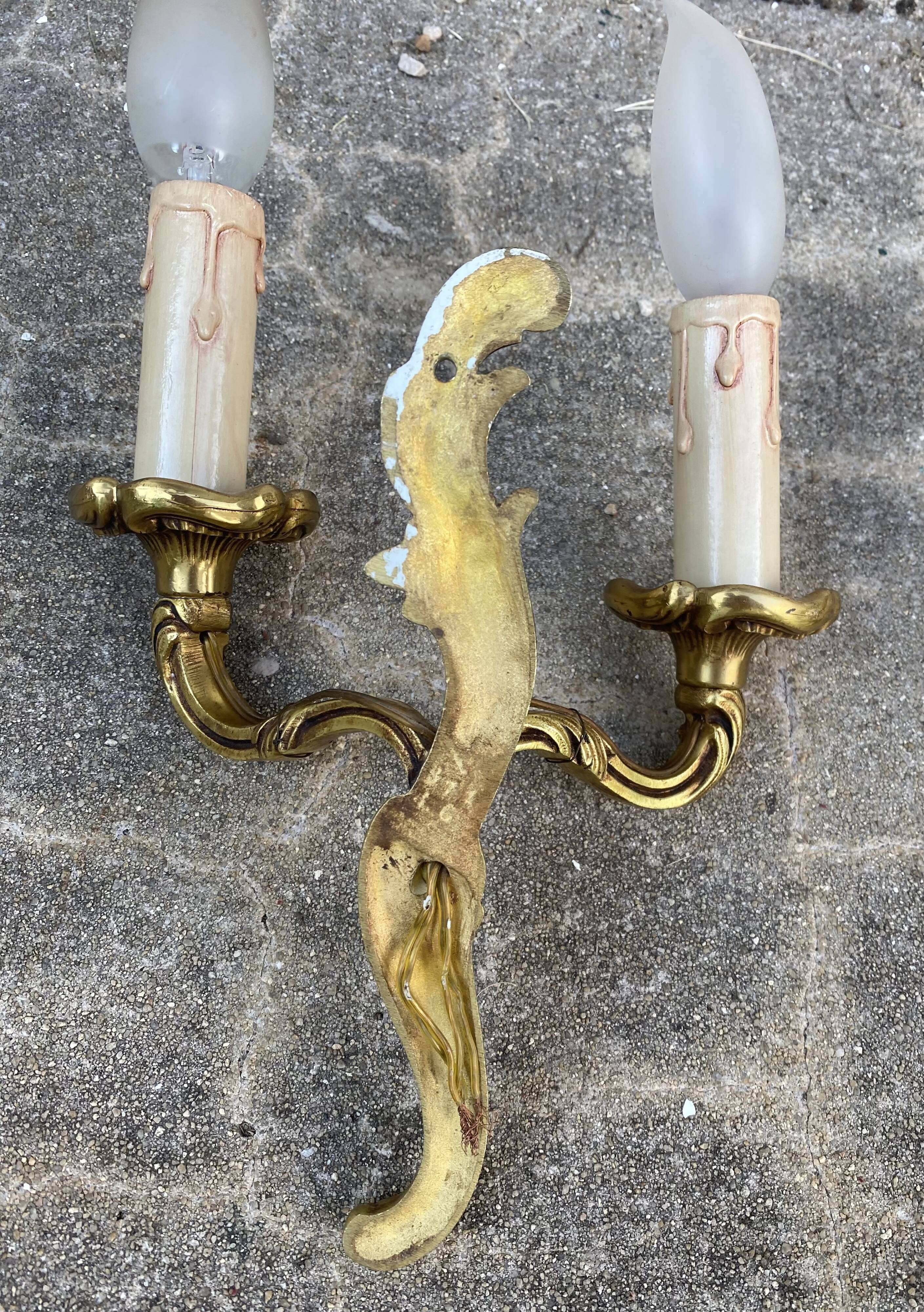 Pair of baroque gilt bronze wall lamps