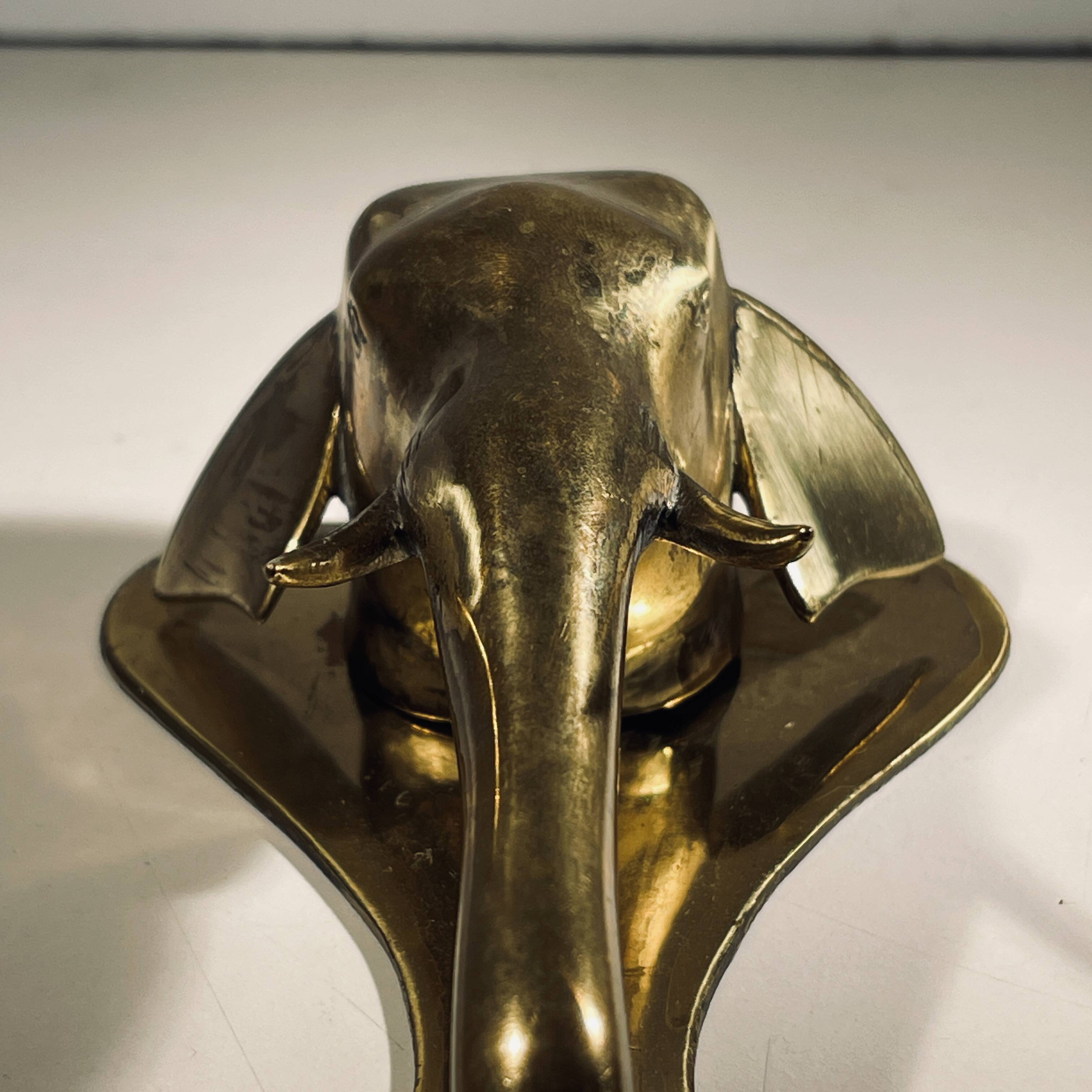 Door knocker / wall paperweight, bronze elephant sculpture