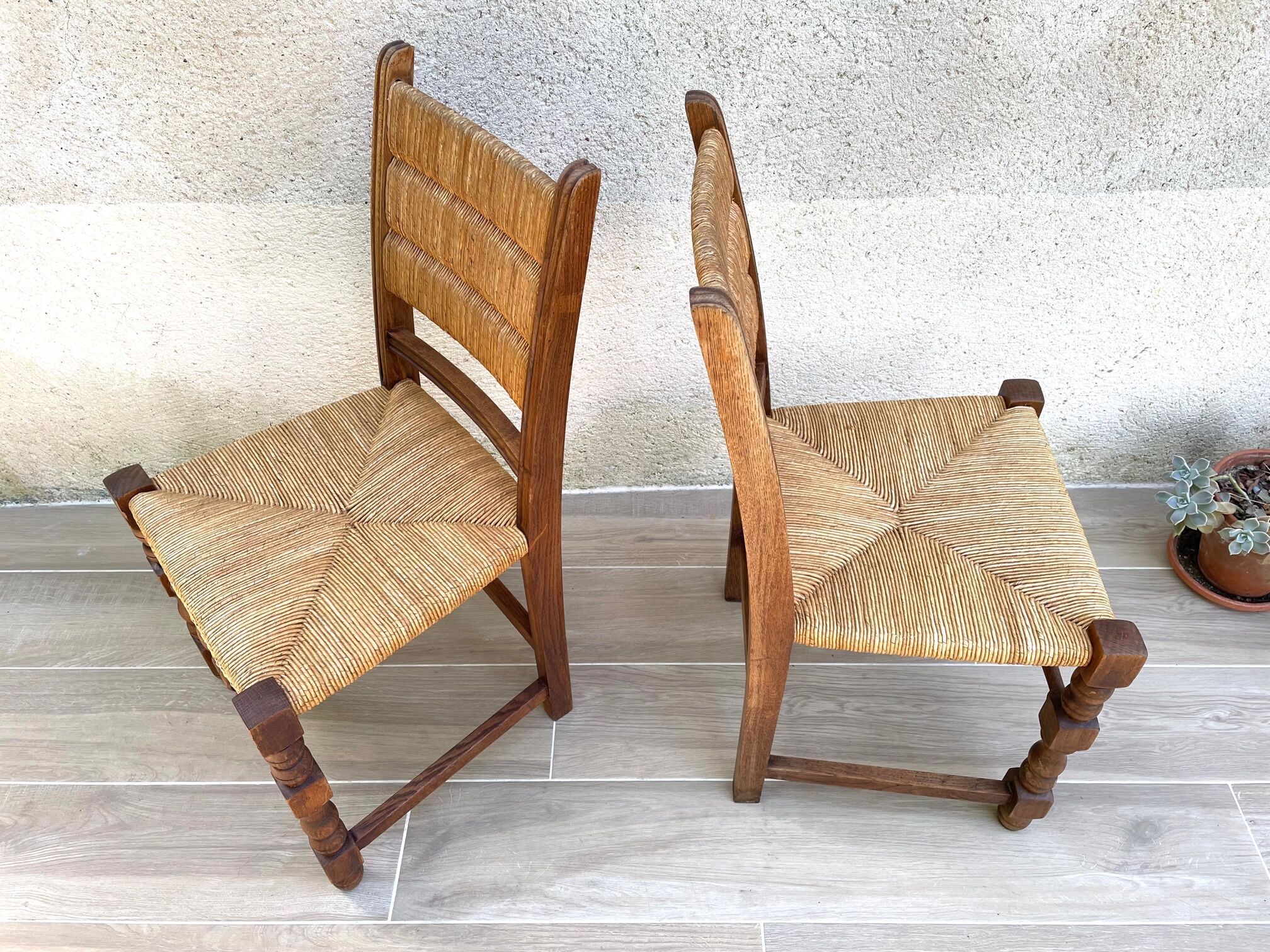 Pair of straw and solid oak chairs
