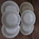 6 old cream-coloured deep plates with blue/orange trim.