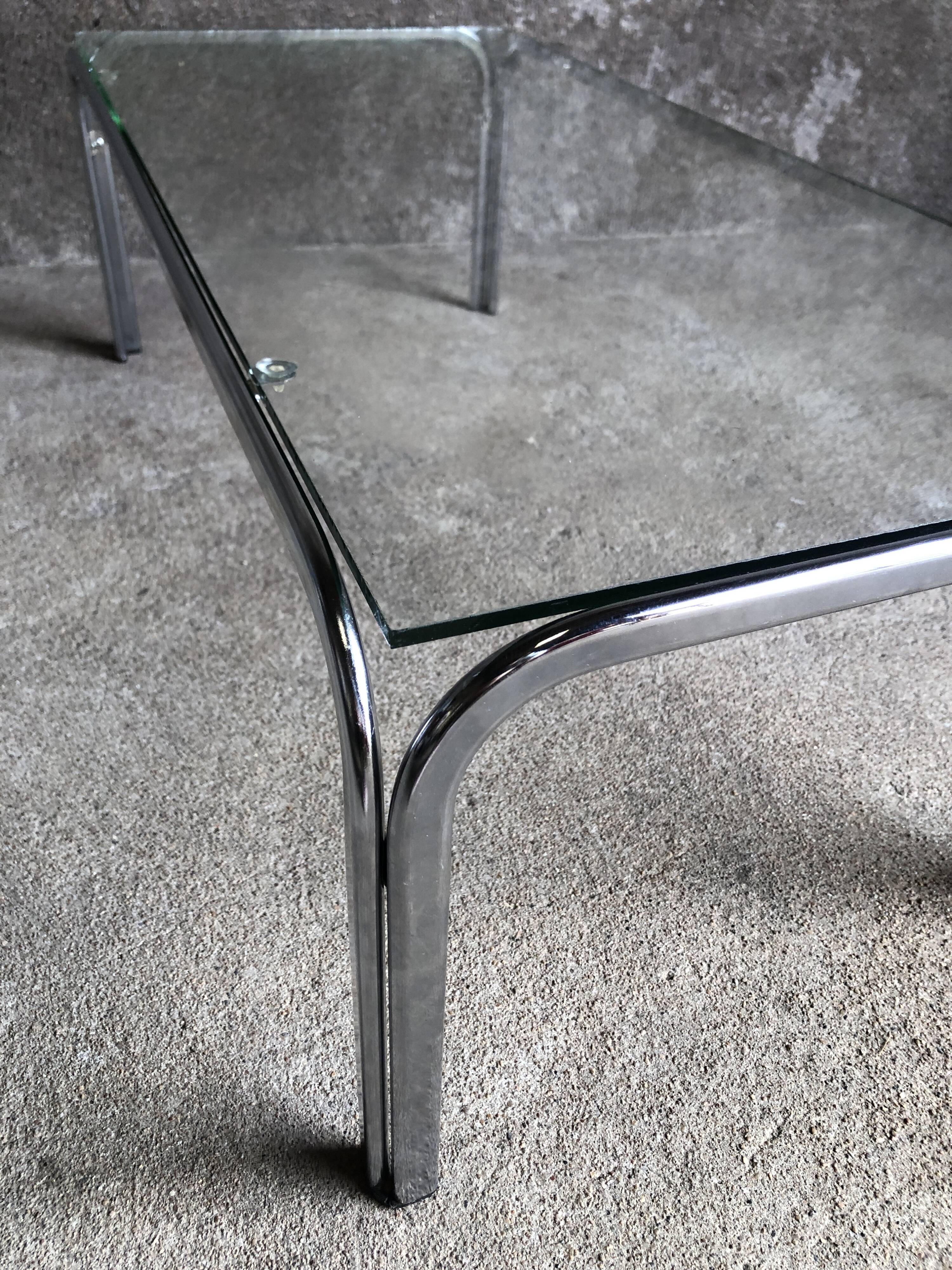 Coffee table with chrome legs and glass top, 1970