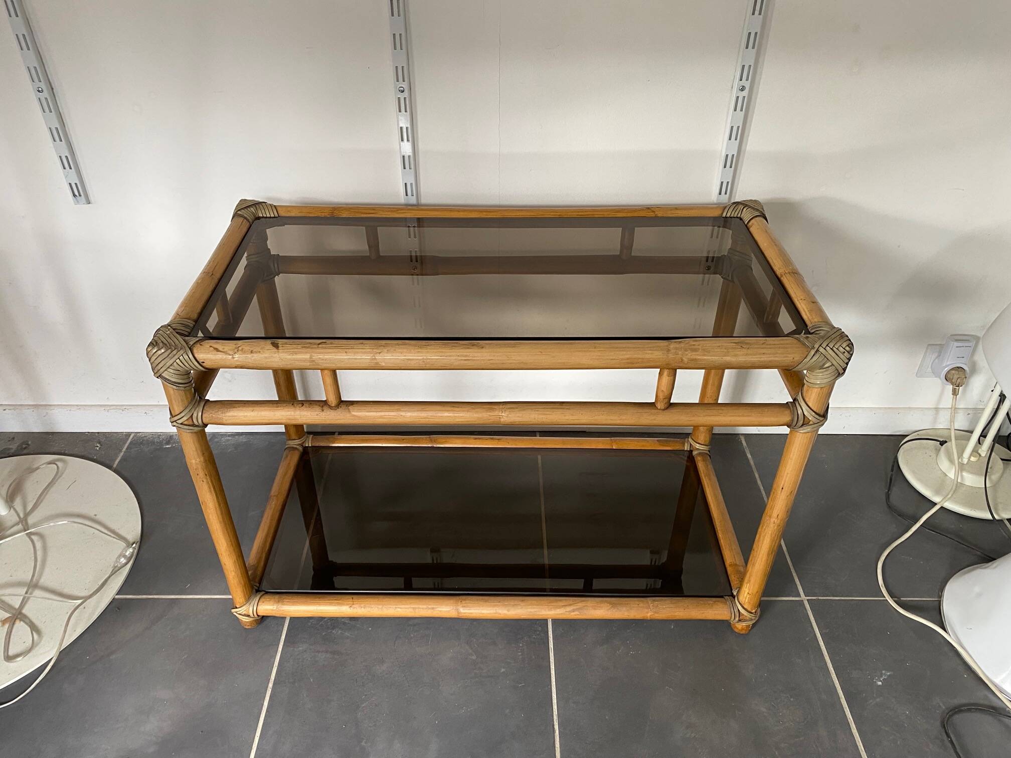 Vintage 1950s rattan and glass TV storage unit.