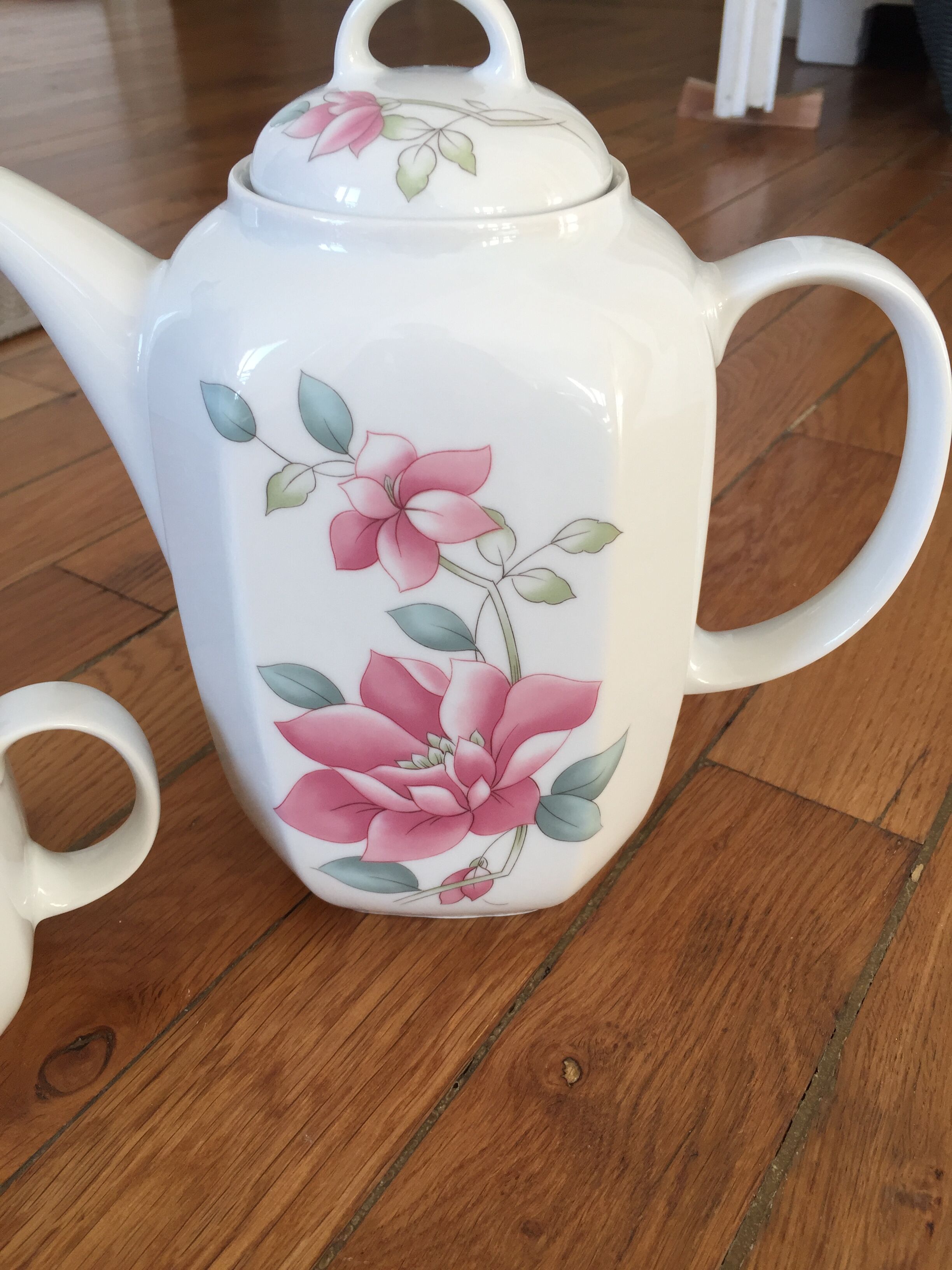 Vintage porcelain coffee or teapot with milk jug