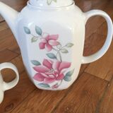 Vintage porcelain coffee or teapot with milk jug