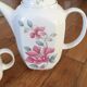 Vintage porcelain coffee or teapot with milk jug