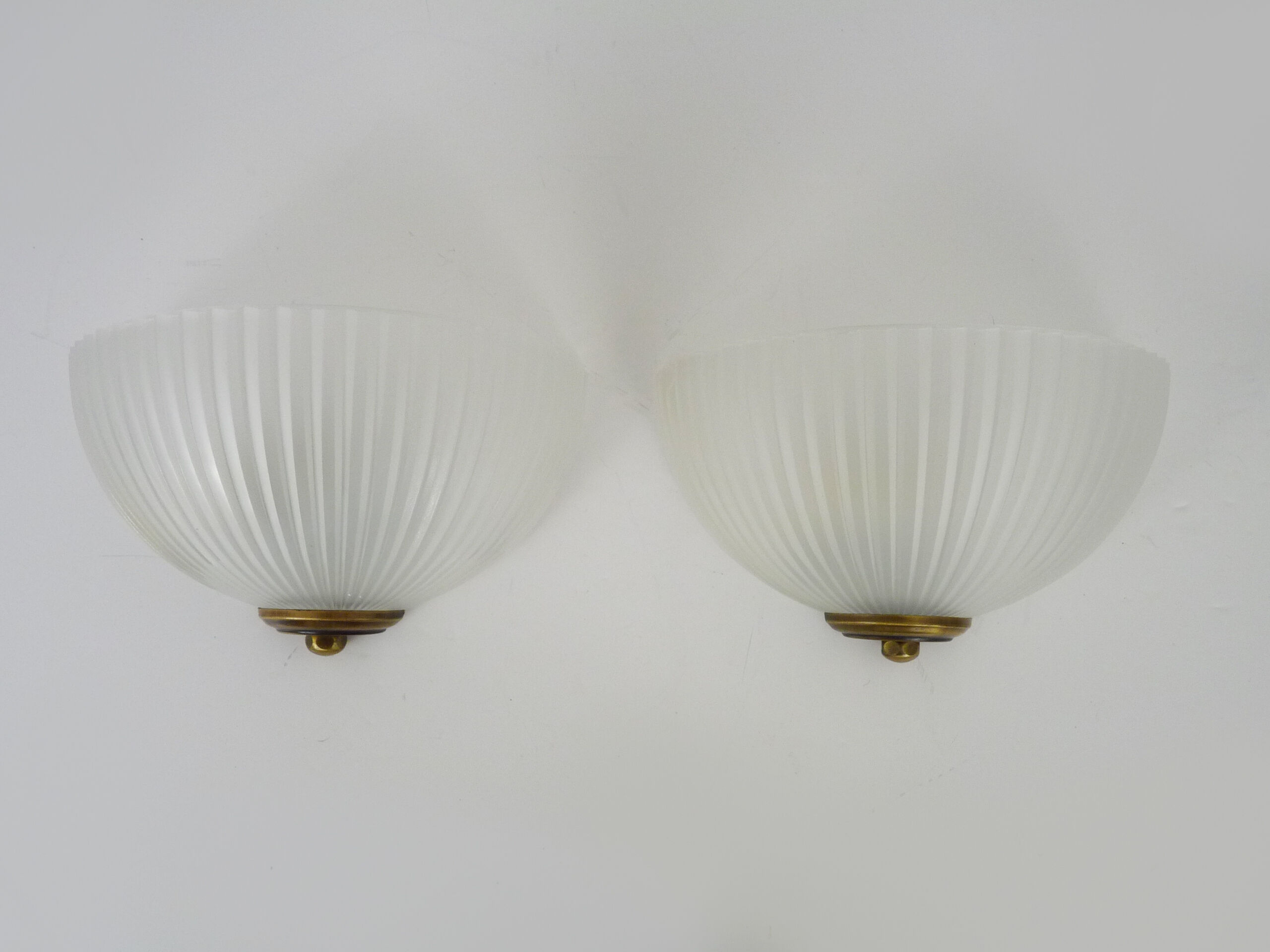 Pair of Mathias wall lamps in gilded metal and white shell-style glass