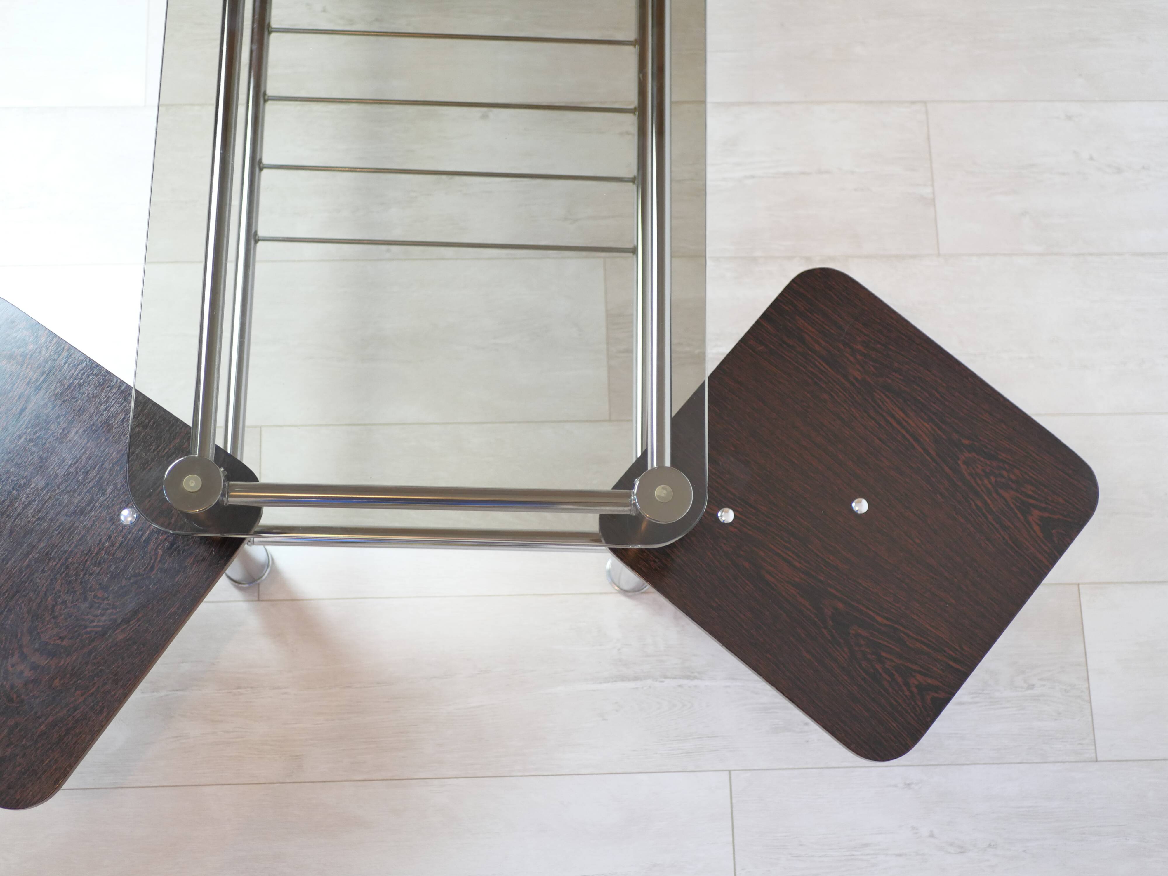 Chrome metal coffee table with smoked glass top.