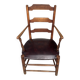 Antique rustic armchair in walnut and leather, 18th century.