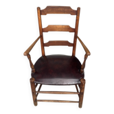 Antique rustic armchair in walnut and leather, 18th century.