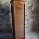 French antique wardrobe with curtain in oak, circa 1920–1930.