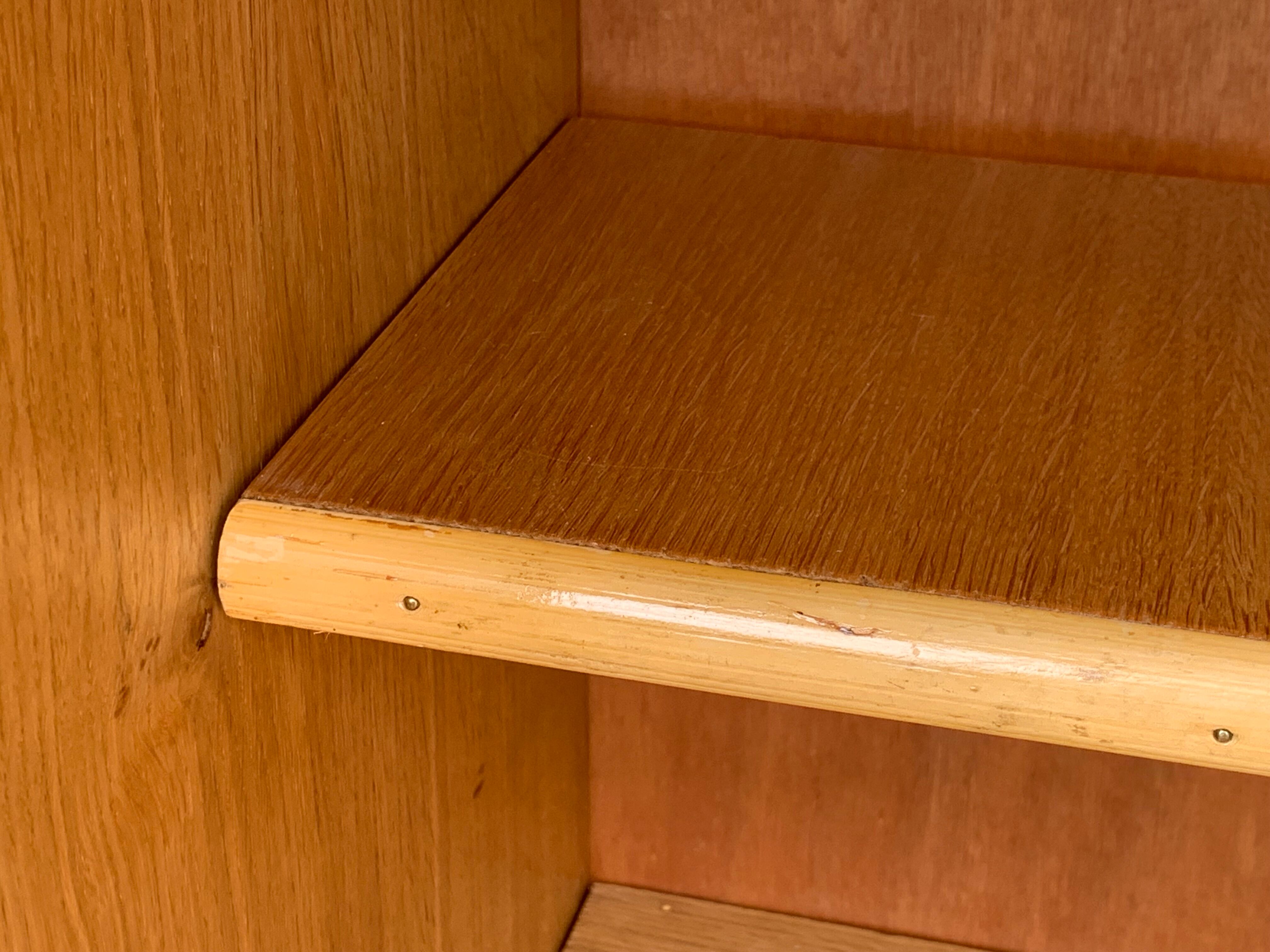Rattan wardrobe with tapered legs from the 1960s.