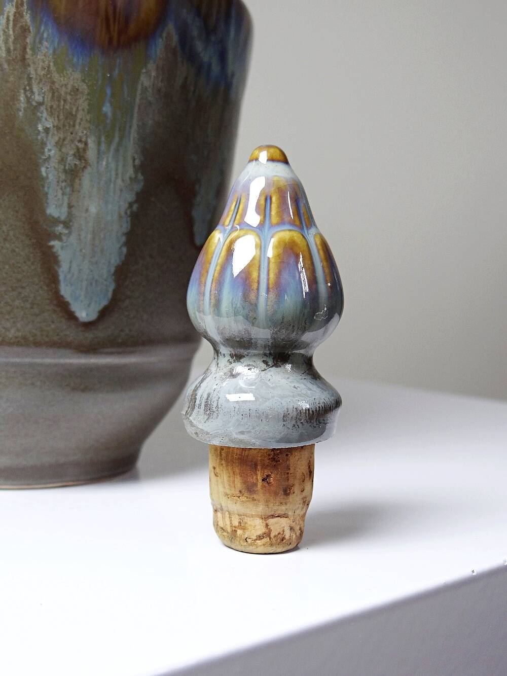 Vintage stoneware bottle with flamed glaze, France 1950-1970.