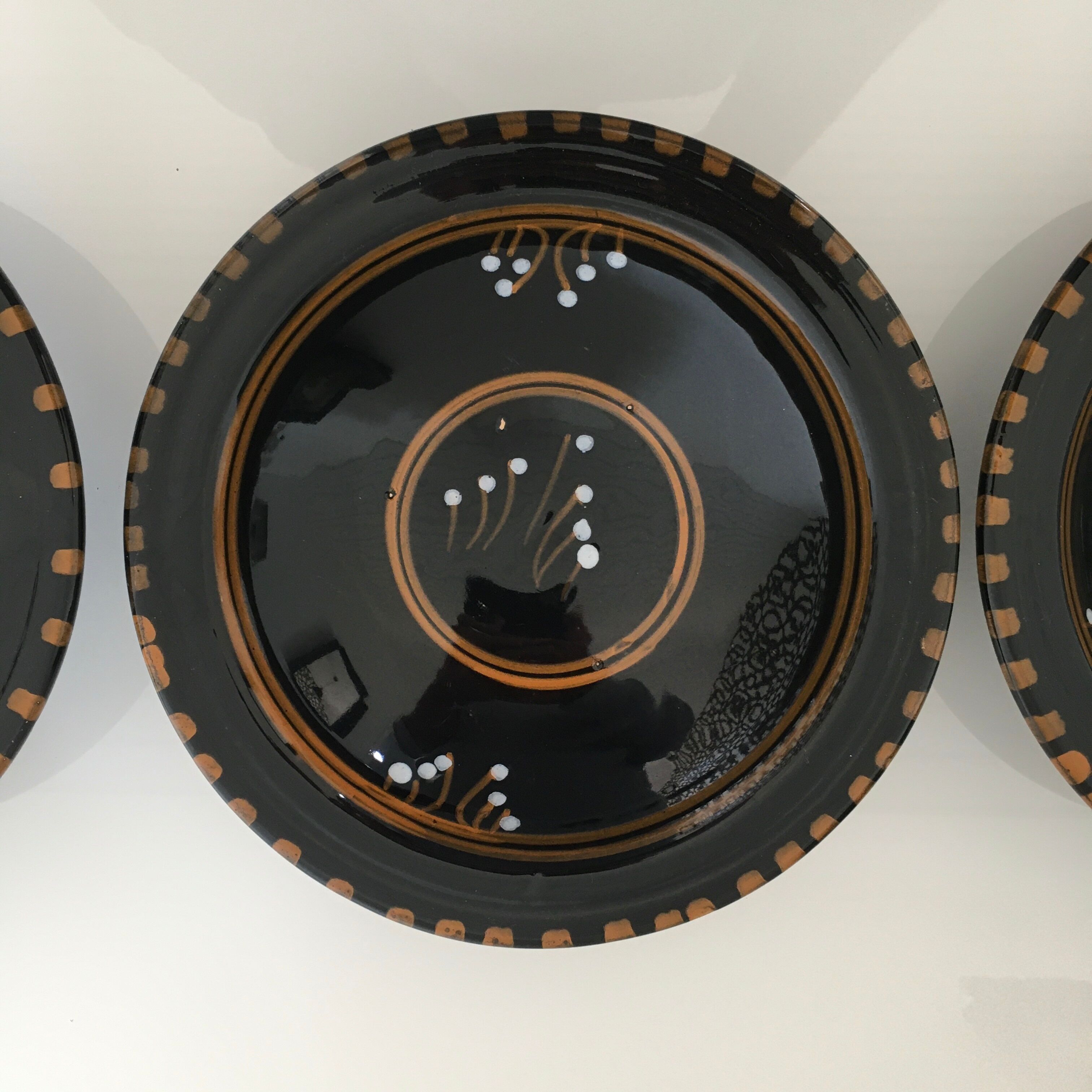 Set of 3 black decorative deep plates.