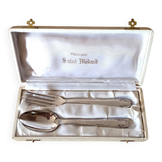 Duo of silver metal cutlery